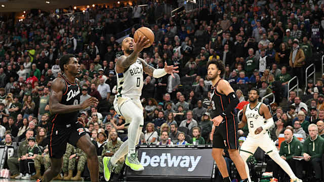 Milwaukee Bucks guard Damian Lillard (0) drives to the basket against the Detroit Pistons